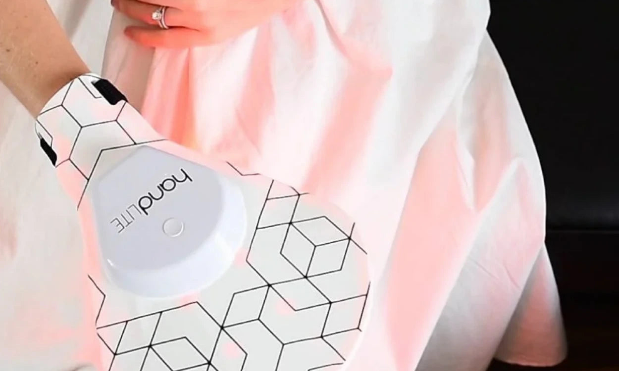 Handheld device with 'handLITE' branding on a geometric-patterned surface.